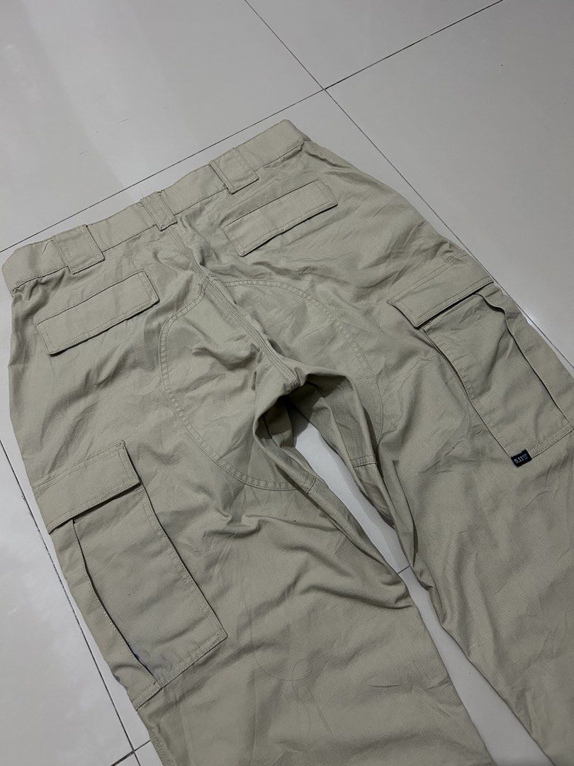 5.11 Tactical Cargo Pants Khaki (Category: Trousers) located in Quezon City. Submitted by commonwealthpickerph (Listing ID 1469282439, Image 2). Description: 5.11 Tactical Series Khaki cargo pants 35 waist 44.5 length 34 inseam 9 opening - in good condition - Has sign of used - 9/10 color rate - Issue: stain ( check pic to see details ) - Fit: Standard straight fit - Material: Durable ripstop fabric construction - Durability: Reinforced knees and