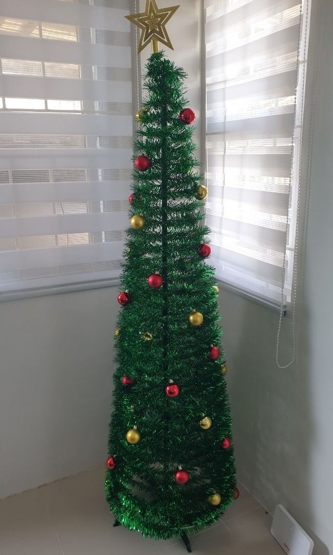 6 FT FOLDABLE CHRISTMAS TREE POP UP ARTIFICIAL TINSEL WITH ORNAMENTS (Category: Other Home Decor) located in Malabon City. Submitted by toughMeg (Listing ID 1469164378, Image 1). Description: 6 FT FOLDABLE CHRISTMAS TREE POP UP ARTIFICIAL TINSEL WITH ORNAMENTS.