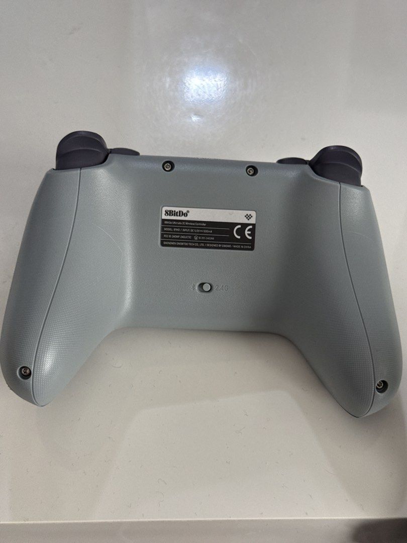 8BitDo Ultimate 2C Wireless Controller Grey (Category: Controllers) located in Kuala Lumpur. Submitted by komi2311 (Listing ID 1469218190, Image 2). Description: - Model: 8BitDo Ultimate 2C Wireless Controller - Color: Grey body with dark grey thumbsticks and D-pad - Connectivity: Bluetooth and 2.4G support - Layout: Standard face button configuration.