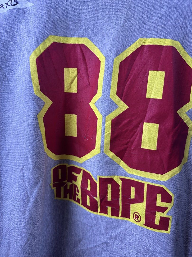 A Bathing Ape BAPE 88 Grey Sweatshirt (Category: Coats, Jackets and Outerwear) located in Manila. Submitted by declutterpromax (Listing ID 1469223229, Image 3). Description: - Brand: A Bathing Ape (BAPE) - Color: Grey - Material: Comfortable cotton fleece - Fit: Regular fit with ribbed cuffs and hem - Design: Eye-catching red and yellow '88' BAPE chest graphic - Details: Sleeve branding and secondary logo patch near the cuff - Sizing: Taped measu