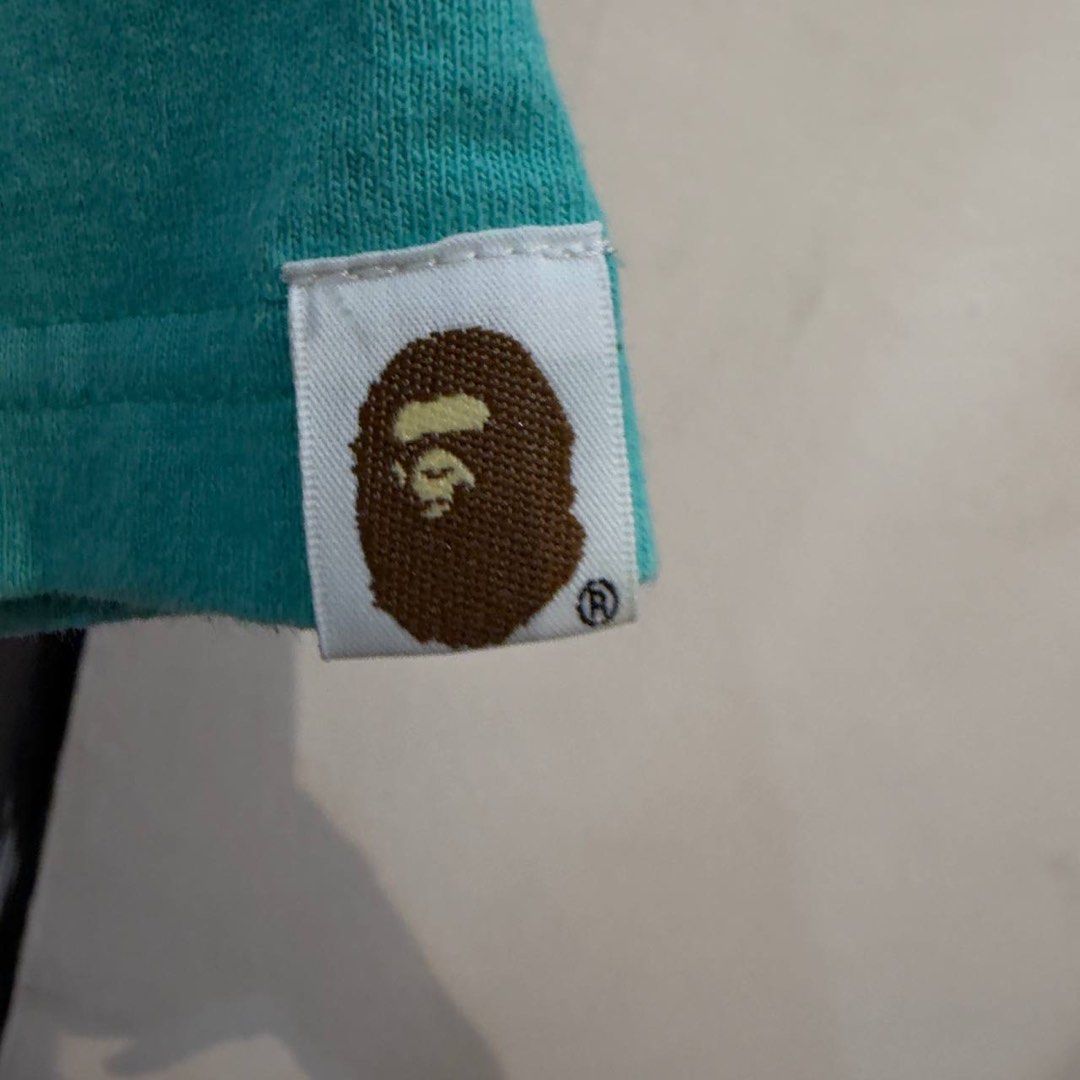 A Bathing Ape WGM Turquoise T-Shirt (Category: Tshirts & Polo Shirts ) located in Manila. Submitted by carbungcoalex (Listing ID 1469332046, Image 2). Description: BAPE SHARK SHIRT 20.5 by 28 Excellent Condition Complete tags 2500 CLAIM.