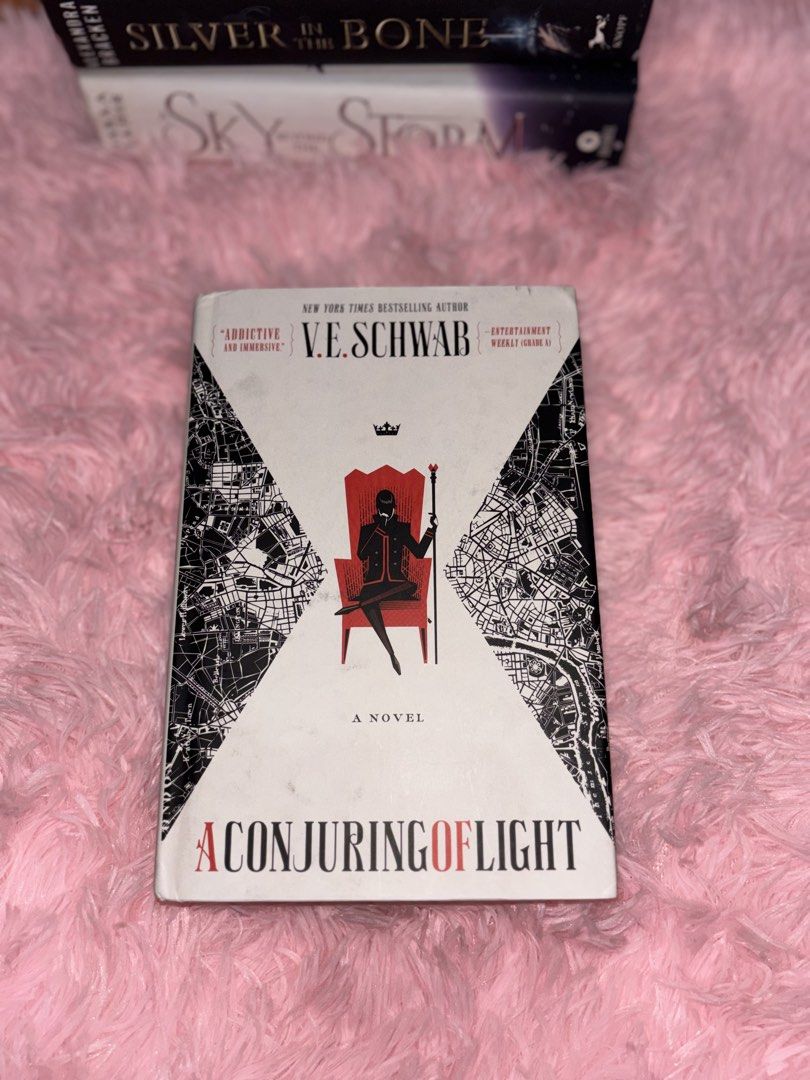 A Conjuring of Light V.E. Schwab Novel (Category: Storybooks) located in Batangas. Submitted by solunarareads (Listing ID 1469202768, Image 1). Description: - Title: A Conjuring of Light by V.E. Schwab - Edition: Hardcover with custom sprayed/patterned edges - Series: Shades of Magic (Book 3) - Condition: Cover intact, clean pages overall, minor spotting on some edges - Genre: Fantasy, urban fantasy, and young adult fiction 📍Batangas City 🚚 TCO