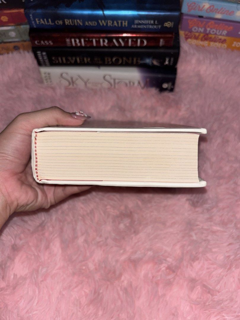 A Conjuring of Light V.E. Schwab Novel (Category: Storybooks) located in Batangas. Submitted by solunarareads (Listing ID 1469202768, Image 3). Description: - Title: A Conjuring of Light by V.E. Schwab - Edition: Hardcover with custom sprayed/patterned edges - Series: Shades of Magic (Book 3) - Condition: Cover intact, clean pages overall, minor spotting on some edges - Genre: Fantasy, urban fantasy, and young adult fiction 📍Batangas City 🚚 TCO