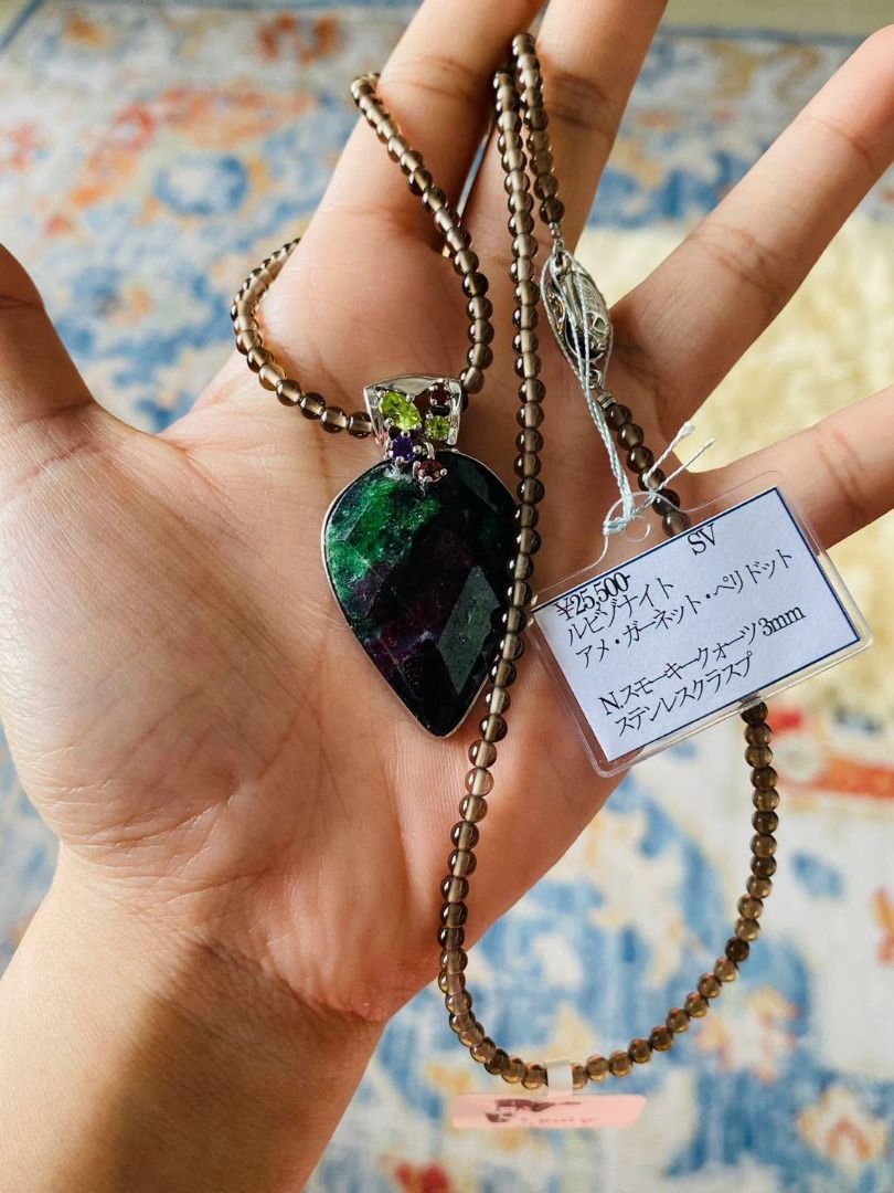 A Statement in Gemstones | Ruby Zoisite & Smoky Quartz Silver Necklace (Category: Necklaces) located in Baguio. Submitted by asna_taku (Listing ID 1469254223, Image 1). Description: 🖤 A Statement in Gemstones | Ruby Zoisite & Smoky Quartz Silver Necklace 💚 Earthy elegance meets bold color. ✨ This striking necklace pairs a captivating ruby zoisite pendant, showcasing rich green and deep burgundy hues, with the warm, smoky glow of 3mm quartz bead