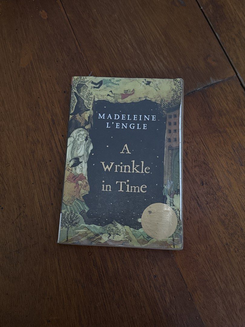 A Wrinkle in Time by Madeleine L'Engle (Category: Storybooks) located in Santo Tomas. Submitted by toughu (Listing ID 1469223111, Image 1). Description: - Title & Author: A Wrinkle in Time by Madeleine L'Engle - Publisher: Square Fish (Paperback) - Genre: Classic Children's Fantasy / Space-Time Travel - Condition: Heavily used, tanning and foxing on pages, taped cover protector, handwritten name on the inside - Readability: All pages are fully in