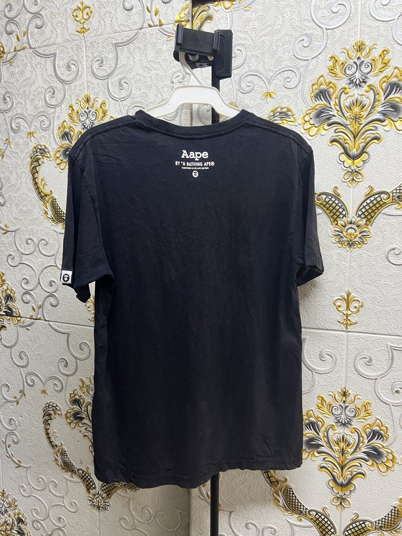 Aape By A Bathing Ape Black Camo Tee (Category: Luxury Apparel) located in Manila. Submitted by irenekaren57943 (Listing ID 1469172568, Image 2). Description: 𒊹︎ AAPE By A Bathing Ape Camo Ape Head Black Tee ➤ 𝟐𝟎 𝐖 | 𝟐𝟕 𝐋 (𝐌𝐞𝐝𝐢𝐮𝐦) ➤ 𝟗.𝟓 | 𝐄𝐱𝐜𝐞𝐥𝐥𝐞𝐧𝐭 ➤ 𝐍𝐨 𝐈𝐬𝐬𝐮𝐞 .