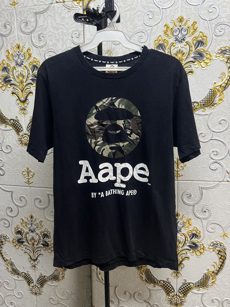 Aape By A Bathing Ape Black Camo Tee (Category: Luxury Apparel) located in Manila. Submitted by irenekaren57943 (Listing ID 1469172568, Image 1). Description: 𒊹︎ AAPE By A Bathing Ape Camo Ape Head Black Tee ➤ 𝟐𝟎 𝐖 | 𝟐𝟕 𝐋 (𝐌𝐞𝐝𝐢𝐮𝐦) ➤ 𝟗.𝟓 | 𝐄𝐱𝐜𝐞𝐥𝐥𝐞𝐧𝐭 ➤ 𝐍𝐨 𝐈𝐬𝐬𝐮𝐞 .