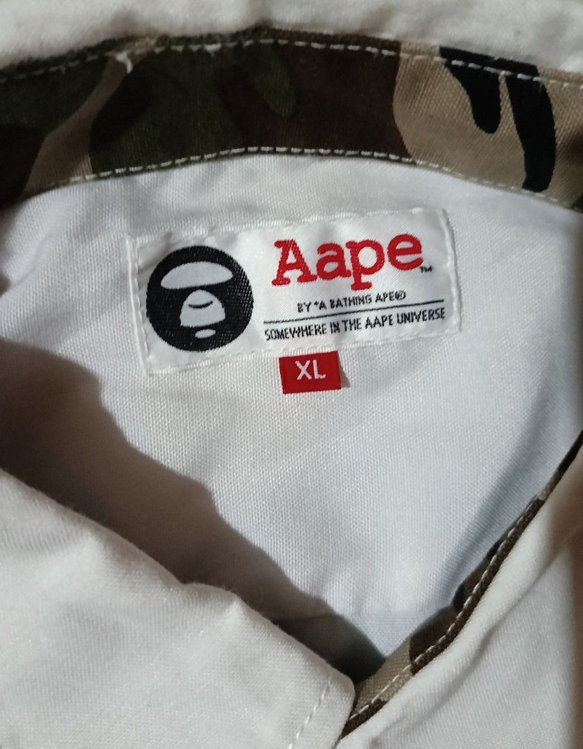 Aape By *A Bathing Ape White Polo (Category: Tshirts & Polo Shirts ) located in Veruela. Submitted by zachysthrift05 (Listing ID 1469311365, Image 3). Description: Dimes: 23 x 29 Excellent Condition No Issues CR: 9.5/10.
