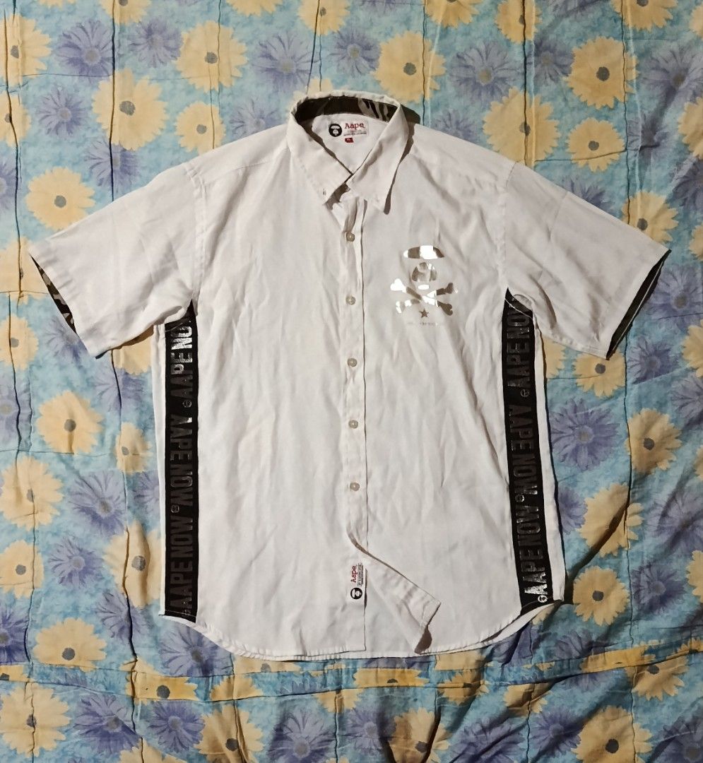 Aape By *A Bathing Ape White Polo (Category: Tshirts & Polo Shirts ) located in Veruela. Submitted by zachysthrift05 (Listing ID 1469311365, Image 1). Description: Dimes: 23 x 29 Excellent Condition No Issues CR: 9.5/10.