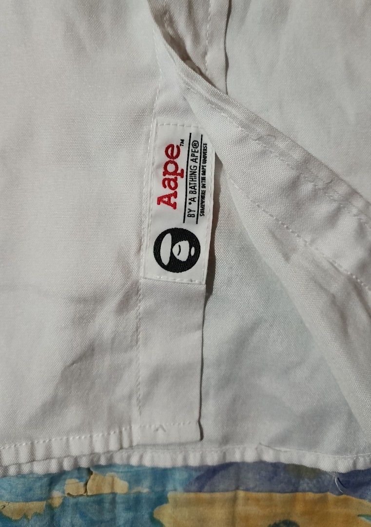 Aape By *A Bathing Ape White Polo (Category: Tshirts & Polo Shirts ) located in Veruela. Submitted by zachysthrift05 (Listing ID 1469311365, Image 2). Description: Dimes: 23 x 29 Excellent Condition No Issues CR: 9.5/10.