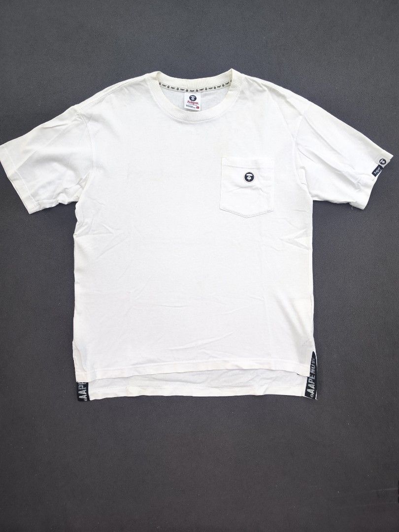 Aape Pocket Tee (Category: Tshirts & Polo Shirts ) located in Bulacan. Submitted by emilj23 (Listing ID 1469196678, Image 1). Description: Aape Pocket Tee Size S on tag L 25 W 20 Condition 9/10 Color rate 9/10 Issue Yellow Stains.