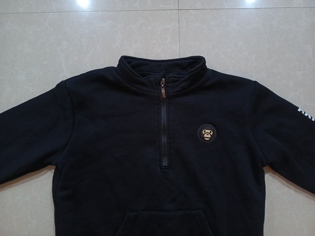Aape Universe Black Quarter Zip Sweatshirt (Category: Coats, Jackets and Outerwear) located in Cabatuan. Submitted by penthegreat (Listing ID 1469163580, Image 2). Description: Off lang, for PSG only 17.5 or 18 width & 19.5 or 20 length - Brand: Aape Universe - Color: Black - Style: Quarter-zip sweatshirt with high collar and kangaroo pocket - Details: Ape logo badge on chest, "AAPE UNIVERSE" printed down the left sleeve - Comfort: Thick fleece l