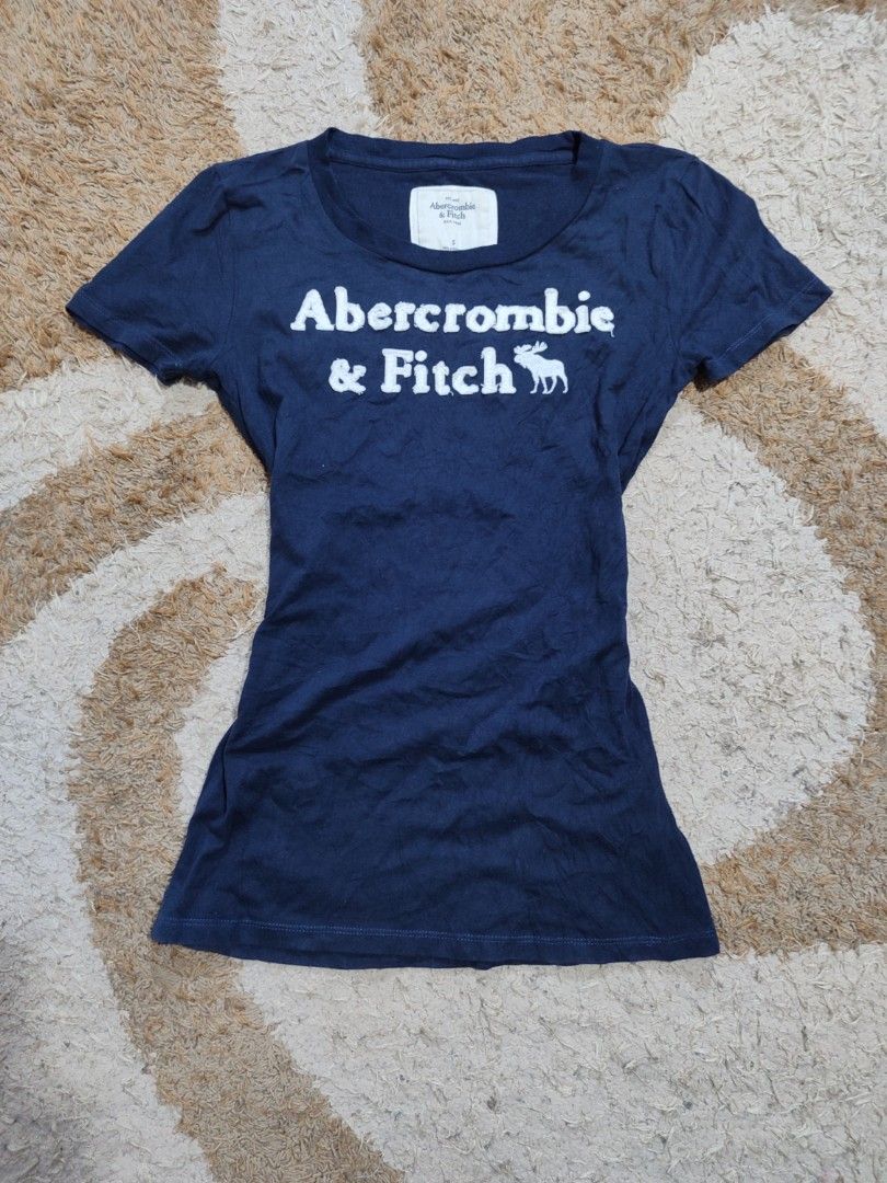 ABERCROMBIE SPELL OUT SHIRT (Category: Shirts) located in Pagadian. Submitted by miraculouspat (Listing ID 1469302115, Image 1). Description: L 23 W 14 10/10 COLOR ASNEW CONDITION AUTHENTIC NO ISSUE COLOR MAY VARY DUE TO LIGHT.