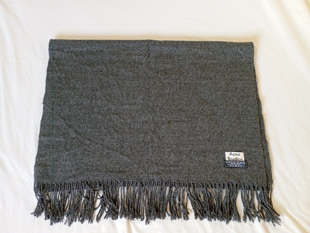 Acne Studios (Category: Scarves) located in Puerto Princesa. Submitted by sefynna96 (Listing ID 1469243145, Image 2). Description: ✨a very large virgin wool scarf ✨ solid gray color ✨ gently used with no stains or tears width: 25 inches length: 73 inches tassels: 4 inches.