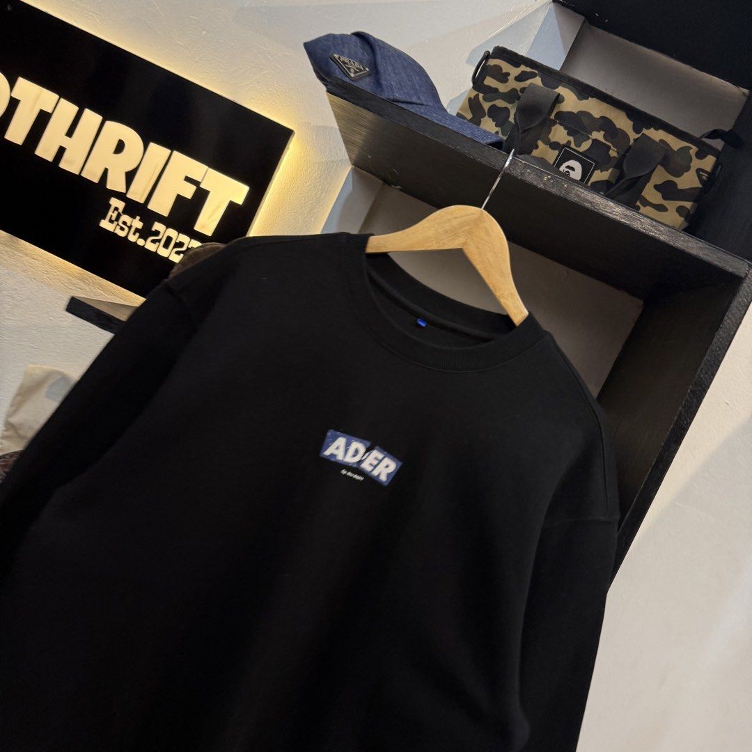 Ader Error Black Sweatshirt With Graphic Logo (Category: Coats, Jackets and Outerwear) located in Manila. Submitted by carbungcoalex (Listing ID 1469335693, Image 2). Description: ADER ERROR MID LOGO BLACK SWEATSHIRT 22 by 28 Good Condition Complete tags 1200 CLAIM.