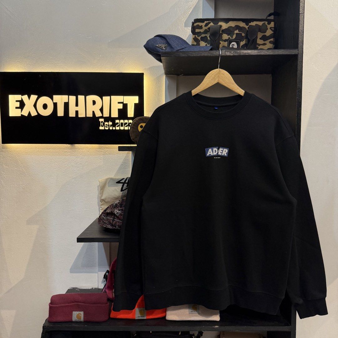 Ader Error Black Sweatshirt With Graphic Logo (Category: Coats, Jackets and Outerwear) located in Manila. Submitted by carbungcoalex (Listing ID 1469335693, Image 1). Description: ADER ERROR MID LOGO BLACK SWEATSHIRT 22 by 28 Good Condition Complete tags 1200 CLAIM.