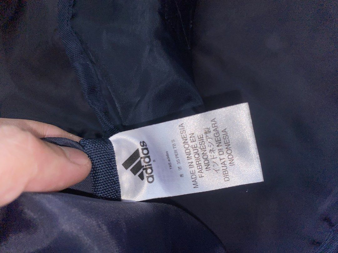 Adidas 3-Stripes Duffle Bag Navy Blue (Category: Sling Bags) located in Manila. Submitted by pems25 (Listing ID 1469245922, Image 3). Description: - Authentic Adidas 3-Stripes small duffle bag in classic navy blue - Made in Indonesia with durable, high-quality materials - Spacious main compartment ideal for gym gear, sports equipment, or short trips - Sturdy zipper compartments on the front and side for extra organization - Convenient double carr