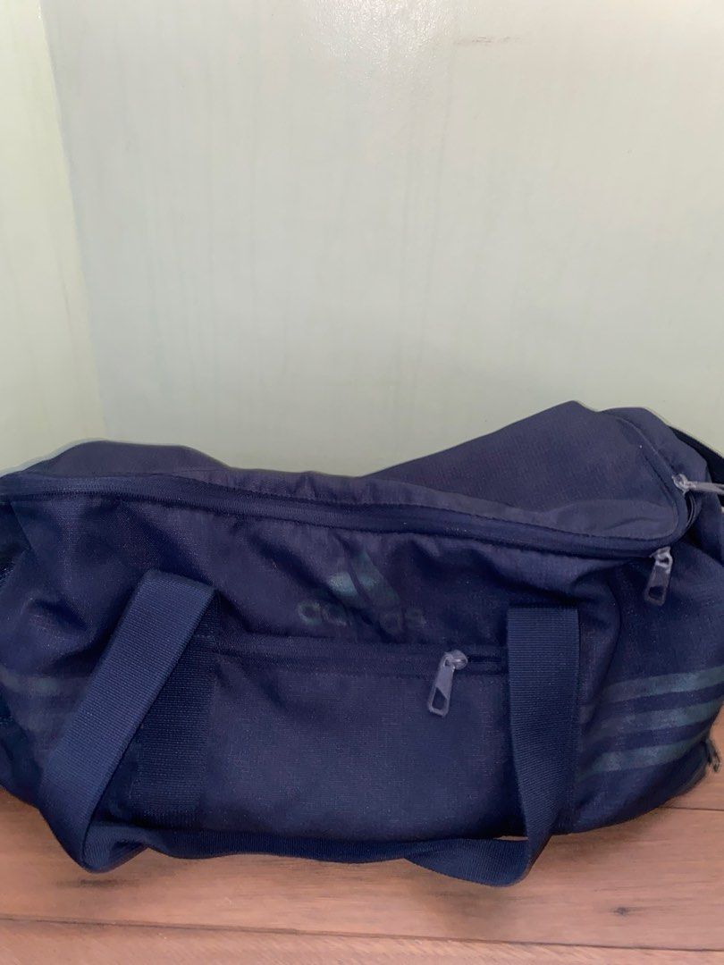 Adidas 3-Stripes Duffle Bag Navy Blue (Category: Sling Bags) located in Manila. Submitted by pems25 (Listing ID 1469245922, Image 1). Description: - Authentic Adidas 3-Stripes small duffle bag in classic navy blue - Made in Indonesia with durable, high-quality materials - Spacious main compartment ideal for gym gear, sports equipment, or short trips - Sturdy zipper compartments on the front and side for extra organization - Convenient double carr
