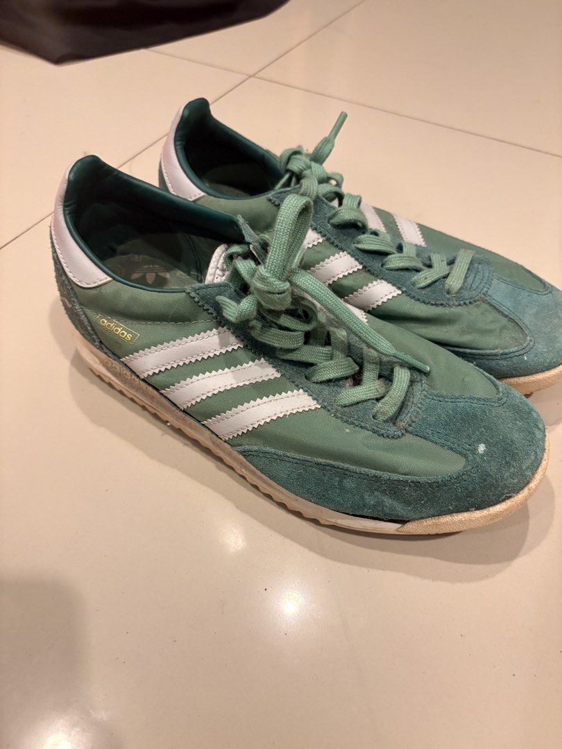 Adidas Green SL 72 Shoes (Category: Sneakers) located in Iloilo. Submitted by cordovaau52846 (Listing ID 1469302544, Image 1). Description: - Brand/Style: Green Adidas vintage-style sneakers - Design: Nylon upper with white three stripes, suede toe cap, and white heel tab - Laces: Matching green laces included - Condition: Minor sole wear from previous use; overall classic retro look - Comfort: Perfect, comfortable pair for everyday wear SF to be
