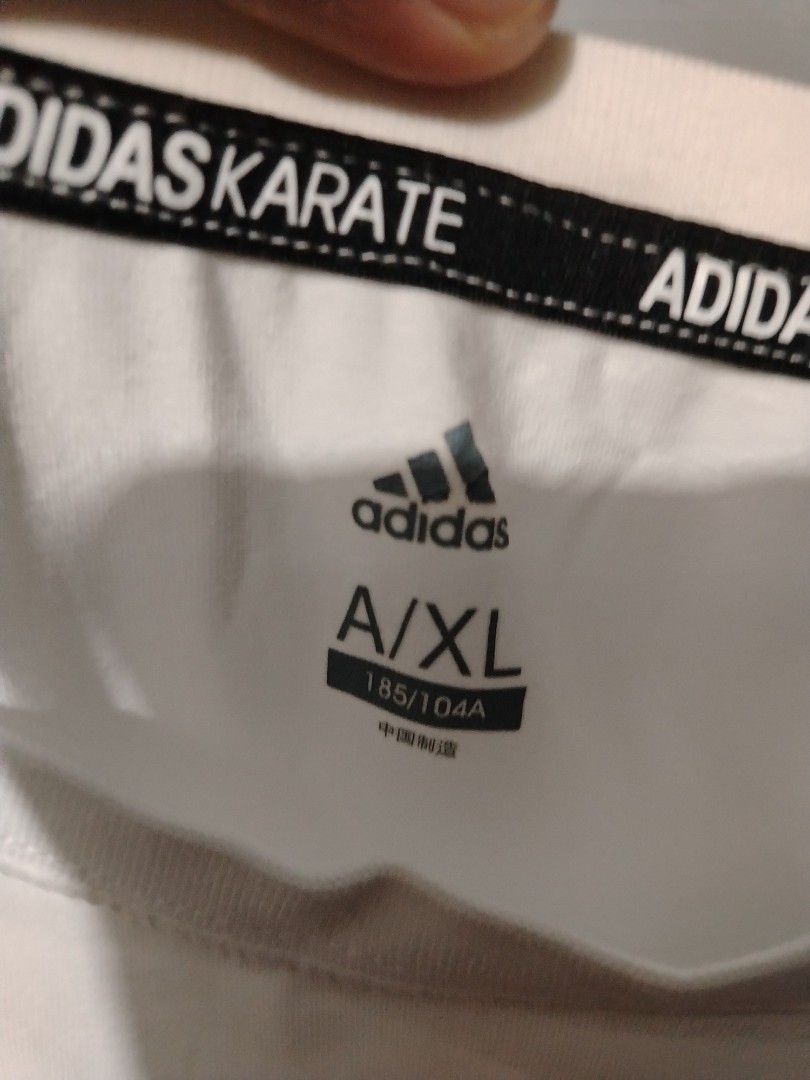 Adidas Karate (Category: Tshirts & Polo Shirts ) located in Bocaue. Submitted by adrianberi35876 (Listing ID 1469252936, Image 3). Description: Adidas Width:21.2 Length:27.5 Streachable Condition:9/10 Color Rate:9/10 Issue:minimsl stain (need rewash) ₱350.