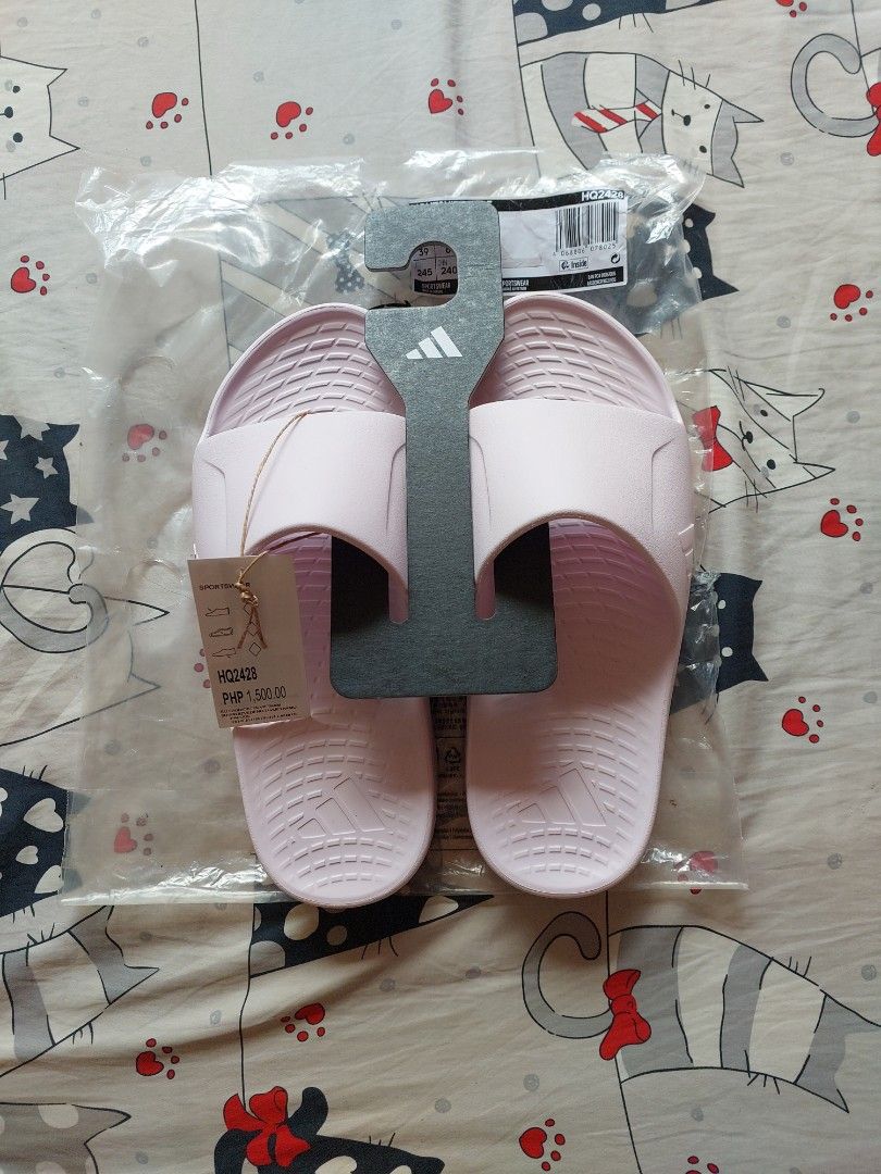 Adidas Lightshift Slide Pink Size UK 6 (Category: Slippers and slides) located in Cebu City. Submitted by choithrift0326 (Listing ID 1469170011, Image 1). Description: - Brand: Adidas - Model: Lightshift (HQ2428) - Color: Pink - Size: US 6 / UK 6 / EU 39 - Condition: Brand new, never worn - Inclusions: Original retail tag (PHP 1,500.00) and original plastic packaging with hanger.