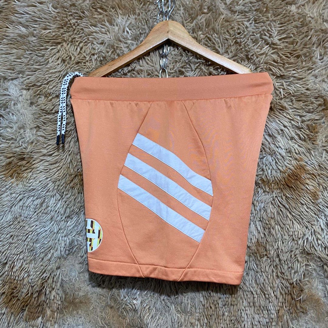 Adidas Orange White Three Stripe Athletic Shorts (Category: Shorts) located in Butuan. Submitted by jc13thrifts (Listing ID 1469342054, Image 2). Description: - Brand: Adidas - Color: Bright orange with white details - Design: Iconic white 3-stripe side panels and circular logo patch on lower left leg - Waistband: Adjustable drawstring with a trendy speckled black-and-white pattern - Branding: White Adidas Performance logo printed near the back w