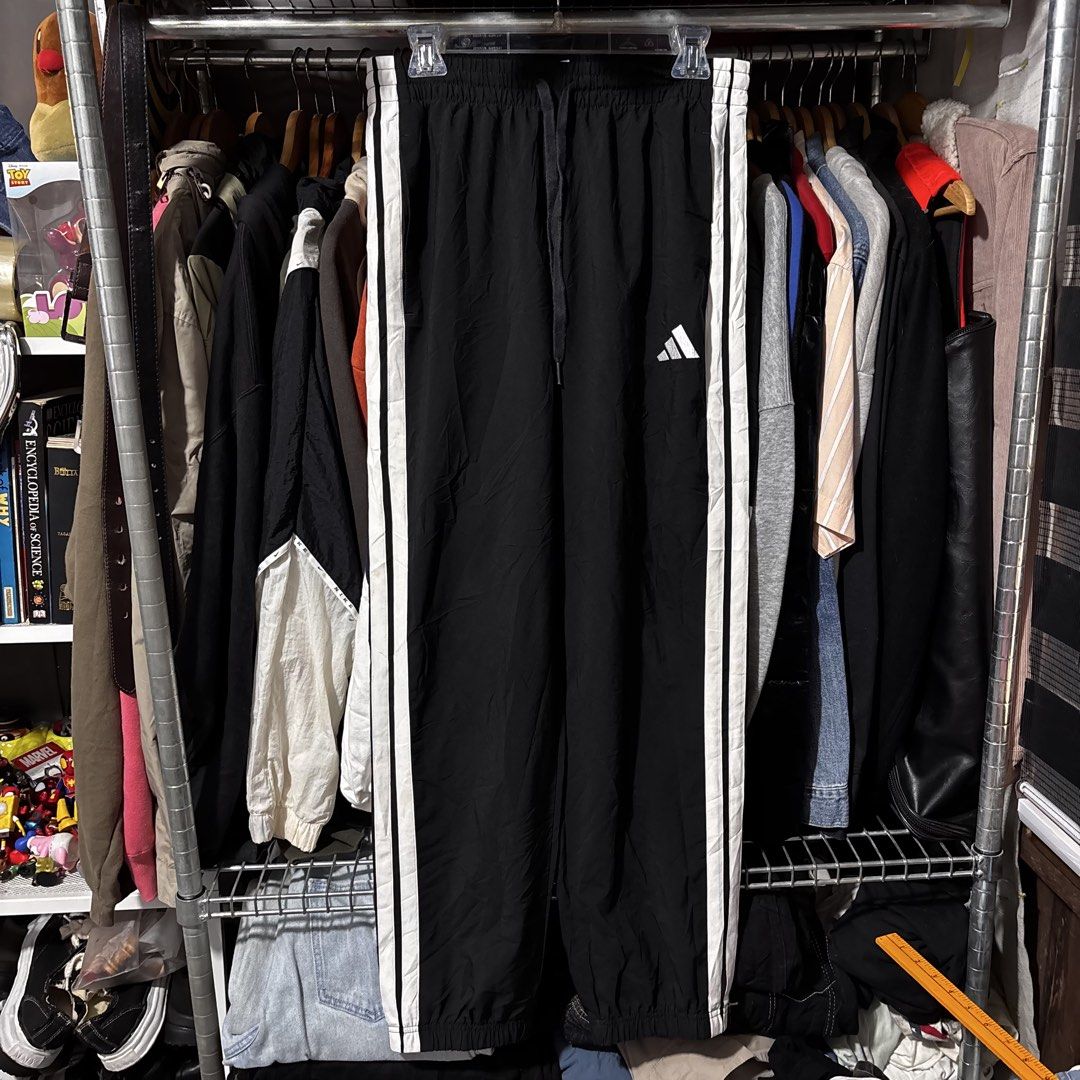Adidas Three Stripes Climacool Track Pants (Category: Joggers) located in Caloocan City. Submitted by bonsatocha43876 (Listing ID 1469326471, Image 2). Description: - Brand: Adidas Climacool - Color: Black with white 3-stripes - Size: M (Waist: 30-34 inches, Length: 39 inches) - Material: 100% recycled polyester (lightweight and breathable) - Features: Elastic waistband with adjustable drawstring, 2 functional pockets - Condition: Excellent, pre-