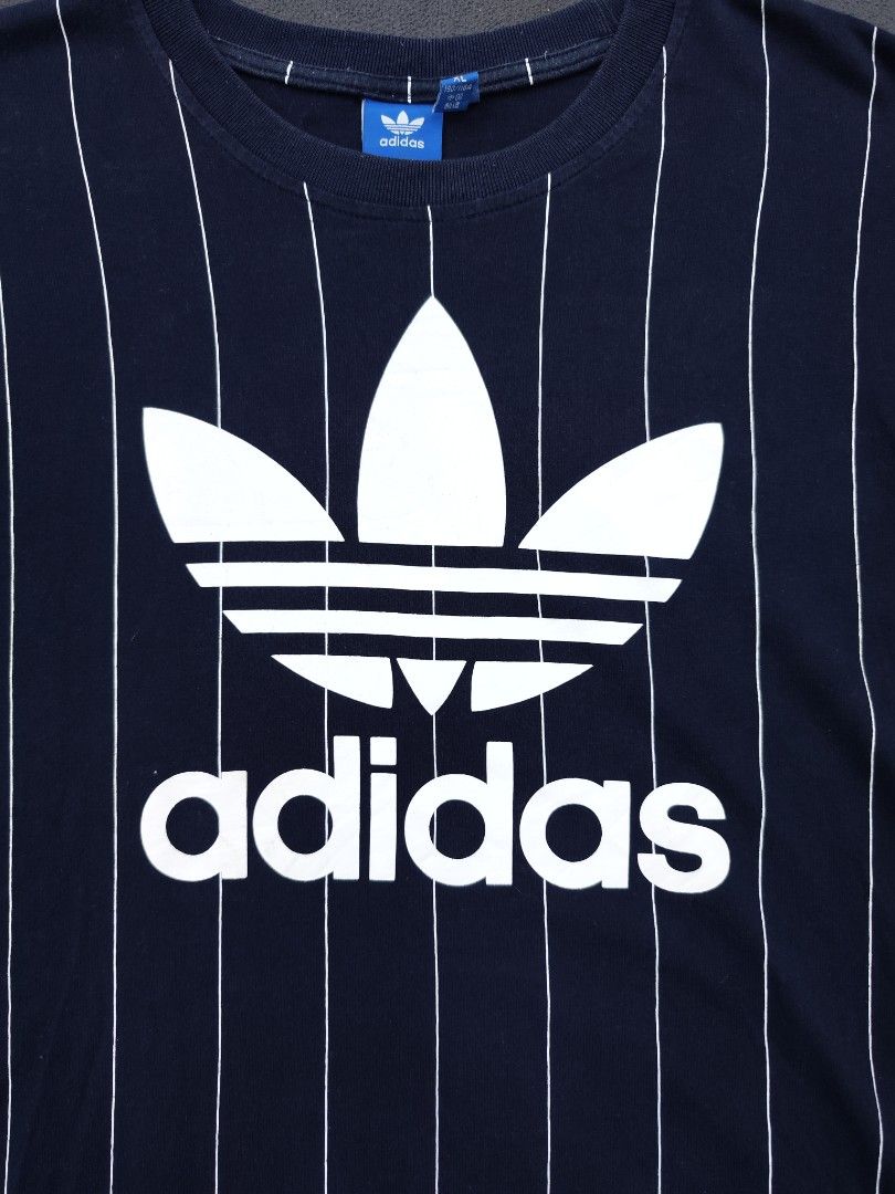 Adidas Trefoil Pinstripes Tee (Category: Tshirts & Polo Shirts ) located in Bulacan. Submitted by emilj23 (Listing ID 1469172336, Image 2). Description: Adidas Trefoil Pinstripes Tee Size XL on tag L 29 W 20 Condition 9/10 Color rate 9/10 Issue Slit,crackprint.