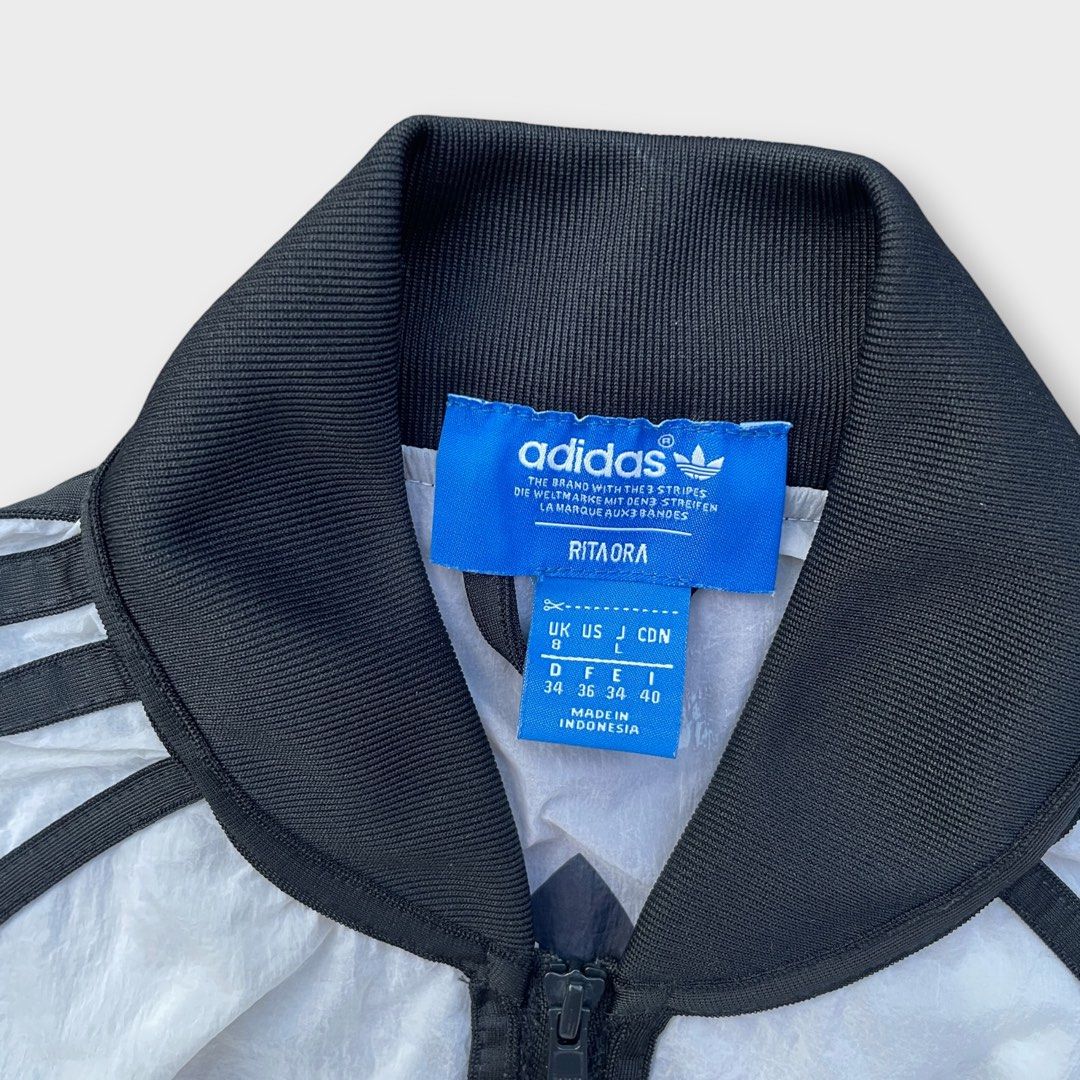 Adidas x Rita Ora - Sheer Layer Bomber Jacket (Category: Activewear) located in Los Banos. Submitted by declutterking (Listing ID 1469355533, Image 3). Description: Size Small on tag • sheer material, see-through • it has some stains due to storage Dimensions: 19" chest 23.25 length 28.5" sleeves (from neck) Excellent condition Authentic.