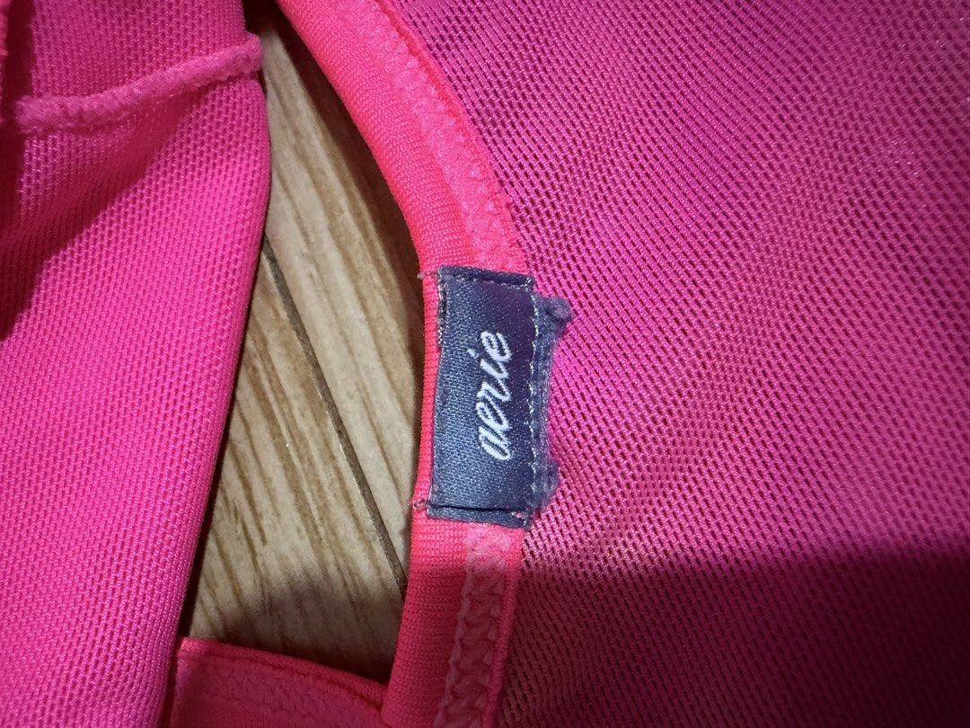 Aerie Neon Pink Bralette (Category: Undergarments & Loungewear) located in Siquijor. Submitted by yhostuff (Listing ID 1469248876, Image 3). Description: - Brand: Aerie - Color: Bright pink - Details: Mesh panels along the top edge and back - Straps: Adjustable thin straps with sliders - Band: Wide supportive underband - Material: Lightweight and breathable - Condition: Clean and ready to wear (label intact).