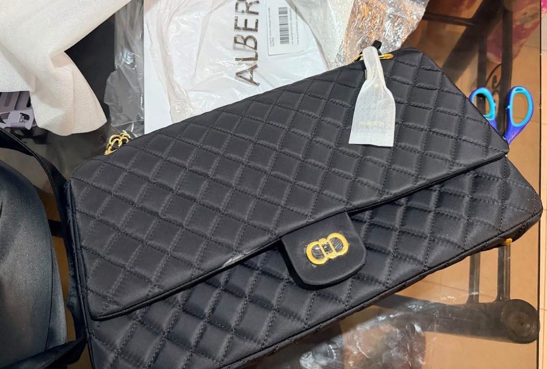 Alberto Black Quilted Shoulder Bag Chain Strap (Category: Luxury Bags & Wallets) located in Mandaue City. Submitted by maeveywavy (Listing ID 1469237879, Image 2). Description: - Brand: Alberto (Brand new with tag attached) Original retail price is Php 2,999 - Color & Design: Classic black quilted design with luxurious gold-tone chain strap and twist-lock clasp closure - Capacity: Fits up to a 16-inch laptop, long wallet, charger, umbrella, and o