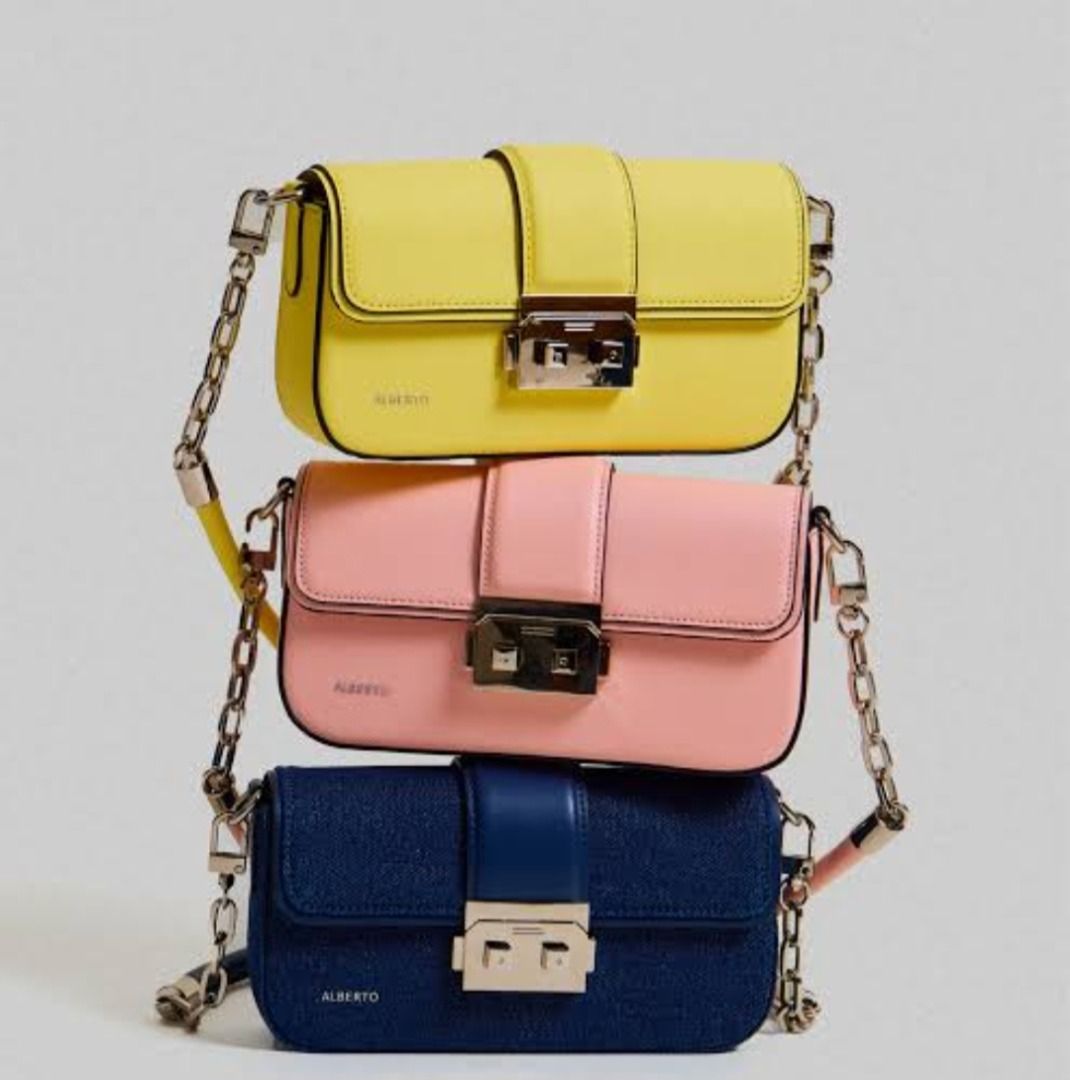 Alberto Prisma Shoulder Bag (Category: Shoulder Bags) located in Quezon City. Submitted by fhttttt28 (Listing ID 1469185038, Image 1). Description: - Brand/Model: Alberto Prisma Shoulder Bag - Design: Clean, structured rectangular shape with a classic top flap closure - Hardware: Secure and stylish metal push-lock closure - Strap: Elegant combination of chain links and a smooth leather top handle - Capacity: Compact size, ideal for carrying your 