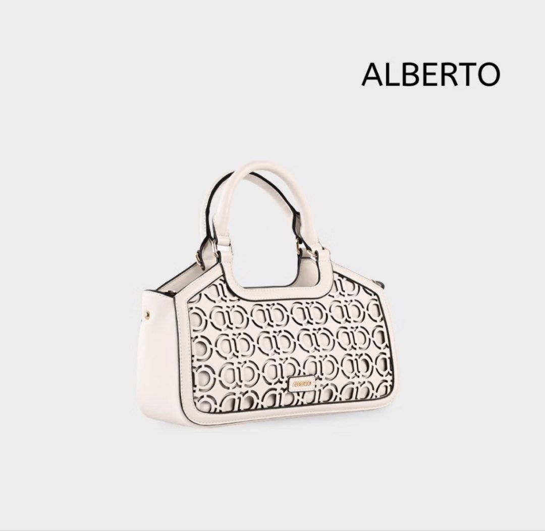 ALBERTO white laser-cut pattern handbag (Category: Luxury Bags & Wallets) located in Marikina City. Submitted by ekarengkeng (Listing ID 1469338803, Image 1). Description: - Brand: ALBERTO - Color: Versatile white with smooth side gussets - Design: Stylish laser-cut circular pattern on the front panel - Hardware: Elegant gold-tone front plaque - Handles: Structured top handles with dark contrast edging - Closure: Secure top zipper closure - Condi