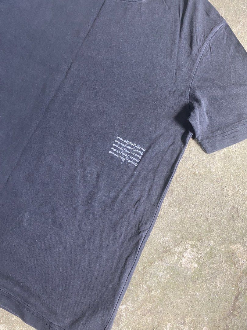 Alexander Wang Black Graphic Tee Size M (Category: Shirts) located in Caloocan City. Submitted by remythrift (Listing ID 1469202568, Image 2). Description: - Brand: Alexander Wang - Color: Black - Size: Medium - Material: 100% Cotton (Body and Rib) - Design: Classic crew neck, short sleeves, and subtle repeated logo print on the lower left front - Origin: Made in Vietnam - Condition: Great everyday basic for effortless styling.
