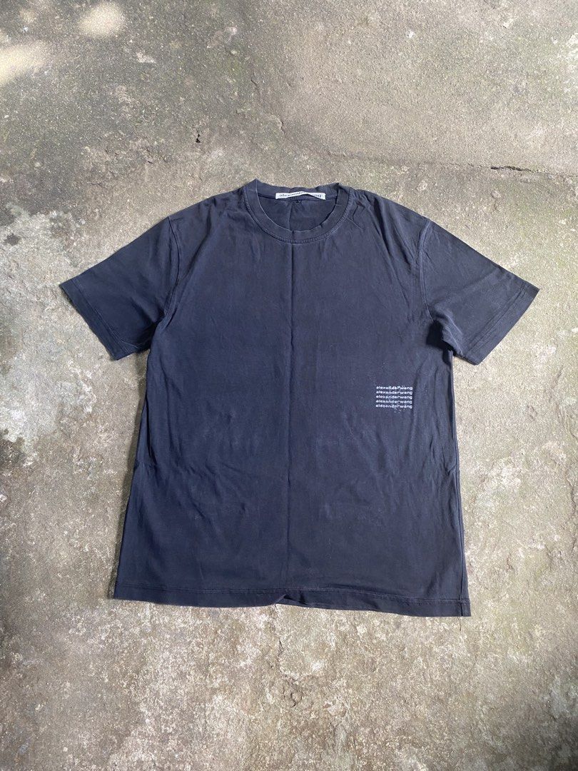 Alexander Wang Black Graphic Tee Size M (Category: Shirts) located in Caloocan City. Submitted by remythrift (Listing ID 1469202568, Image 1). Description: - Brand: Alexander Wang - Color: Black - Size: Medium - Material: 100% Cotton (Body and Rib) - Design: Classic crew neck, short sleeves, and subtle repeated logo print on the lower left front - Origin: Made in Vietnam - Condition: Great everyday basic for effortless styling.