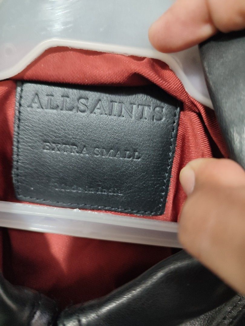 AllSaints Leather Biker Jacket Extra Small (Category: Coats, Jackets and Outerwear) located in Puerto Princesa. Submitted by thriftedsoulsy2k (Listing ID 1469169495, Image 3). Description: - Brand/Model: AllSaints Black Leather Biker Jacket - Size: Extra Small (XS) - Style: Classic moto design with smooth leather finish - Hardware: Silver-tone hardware with asymmetrical zip closure - Details: Shoulder epaulets, multiple zipped pockets, and a buck