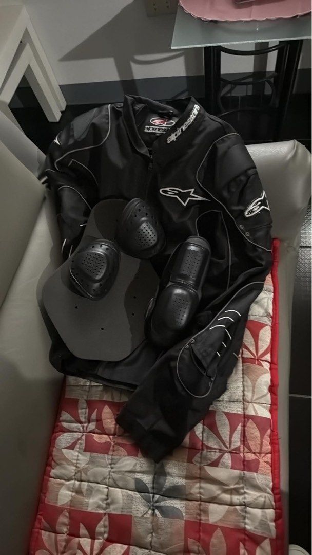 Alpinestars Black Motorcycle Jacket with Armor Pads (Category: Coats, Jackets and Outerwear) located in Makati City. Submitted by wallie_11 (Listing ID 1469166500, Image 1). Description: - Brand: Alpinestars - Color: Black with white piping - Protection: Includes removable armor pads for back, shoulders, and elbows - Features: Full front zip closure, zipped hand pockets, and adjustable waist straps - Condition: Durable, high-quality riding gear f