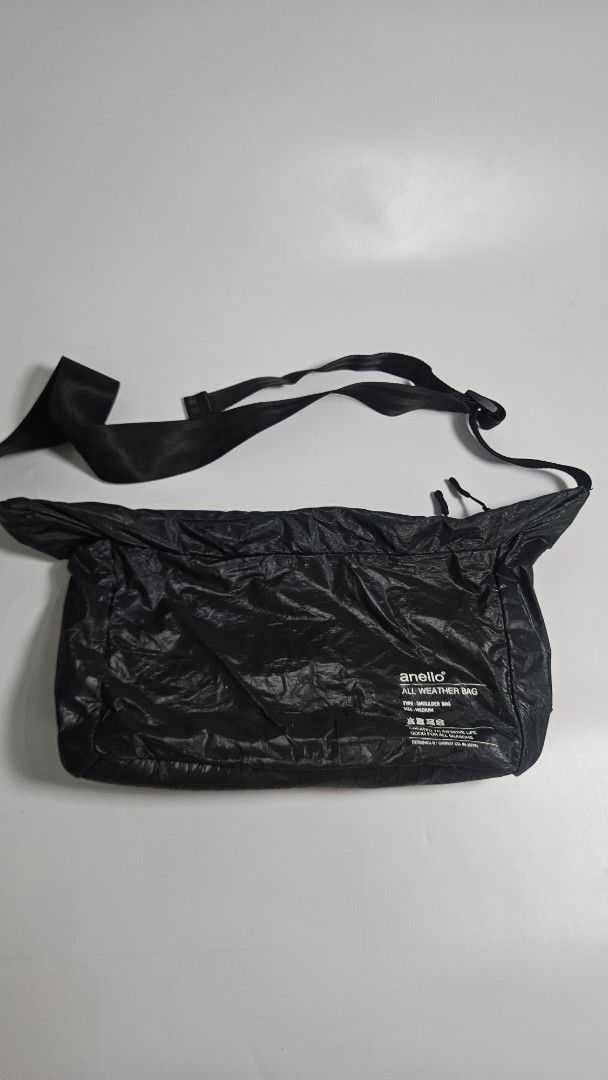 anello All Weather Shoulder Bag Medium Black (Category: Sling Bags) located in Alfonso. Submitted by jbcamet (Listing ID 1469272785, Image 1). Description: - Authentic anello medium shoulder bag designed by Carrot Co. in Japan - Made from durable, stylish black crinkled nylon material - Equipped with waterproof zippers to keep your essentials safe on rainy days - Spacious main compartment featuring convenient inner pockets - Adjustable wide shoul
