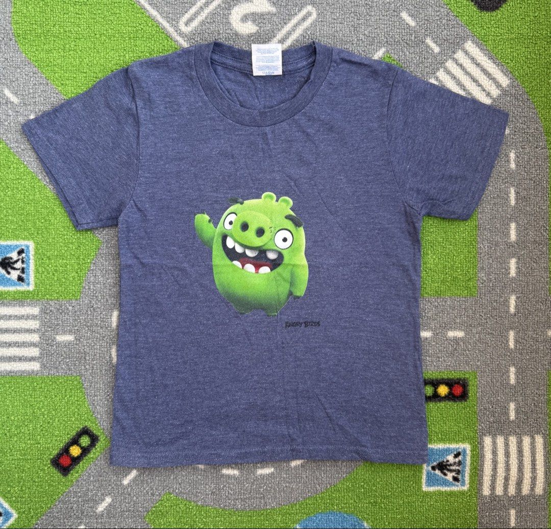 Angry Birds Graphic T-Shirt (Category: Babies & Kids Fashion) located in Rizal. Submitted by preloovved (Listing ID 1469219266, Image 1). Description: Blue heather Angry Birds Leonard the green pig t-shirt for kids. Soft cotton blend, crew neck, short sleeves. Perfect for young gamers! Grab it now. Preloved, 8yo Meet-up only in GB1 San Mateo, Rizal Shipping fee c/o buyer. Tres Marias or J&T express Payment to be sent to me via BPI/BDO/GCASH only.