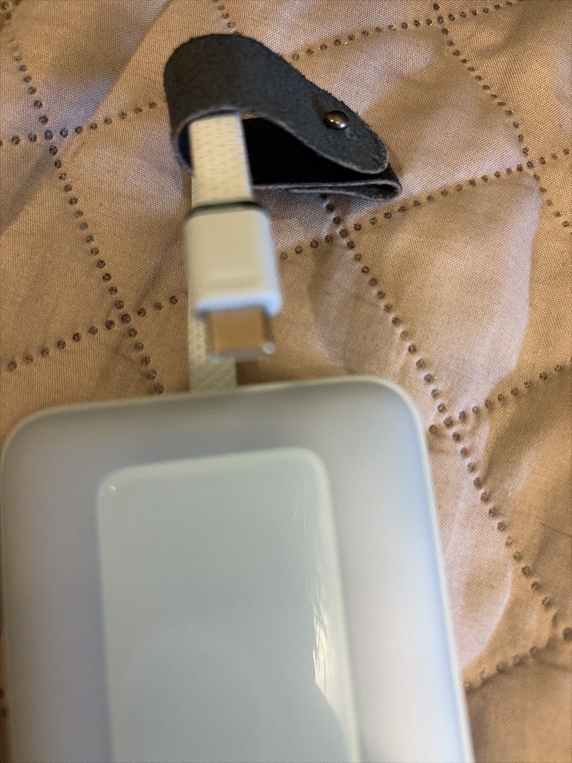 Anker for iPhone 17 air (Category: Chargers & Cables) located in Mandaluyong City. Submitted by iheartsokorpear (Listing ID 1469166687, Image 1). Description: - Brand: Anker - Color: Clean White - Includes attached USB-C style cable with premium connector - Comes with a stylish dark leather strap organizer with snap button - Sleek, minimalist design suitable for modern smartphones - Excellent pre-loved condition.