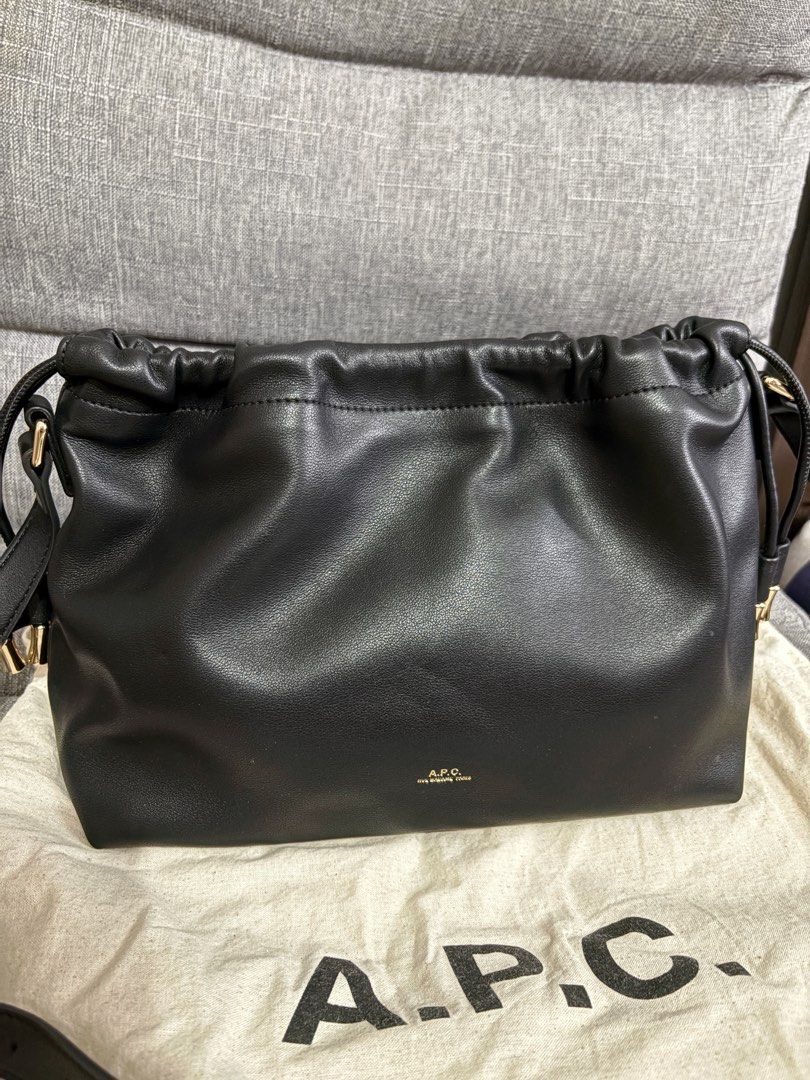 A.P.C. Black Leather Crossbody Bag (Category: Luxury Bags & Wallets) located in Manila. Submitted by topsh0ppe (Listing ID 1469243603, Image 3). Description: - Brand: A.P.C. - Material: Premium black leather with gold-tone hardware - Closure: Drawstring top with a secure magnetic snap button - Interior: Clean lining with a convenient open slip pocket - Strap: Adjustable shoulder strap for a custom fit - Inclusion: Comes with the original A.P.C. d