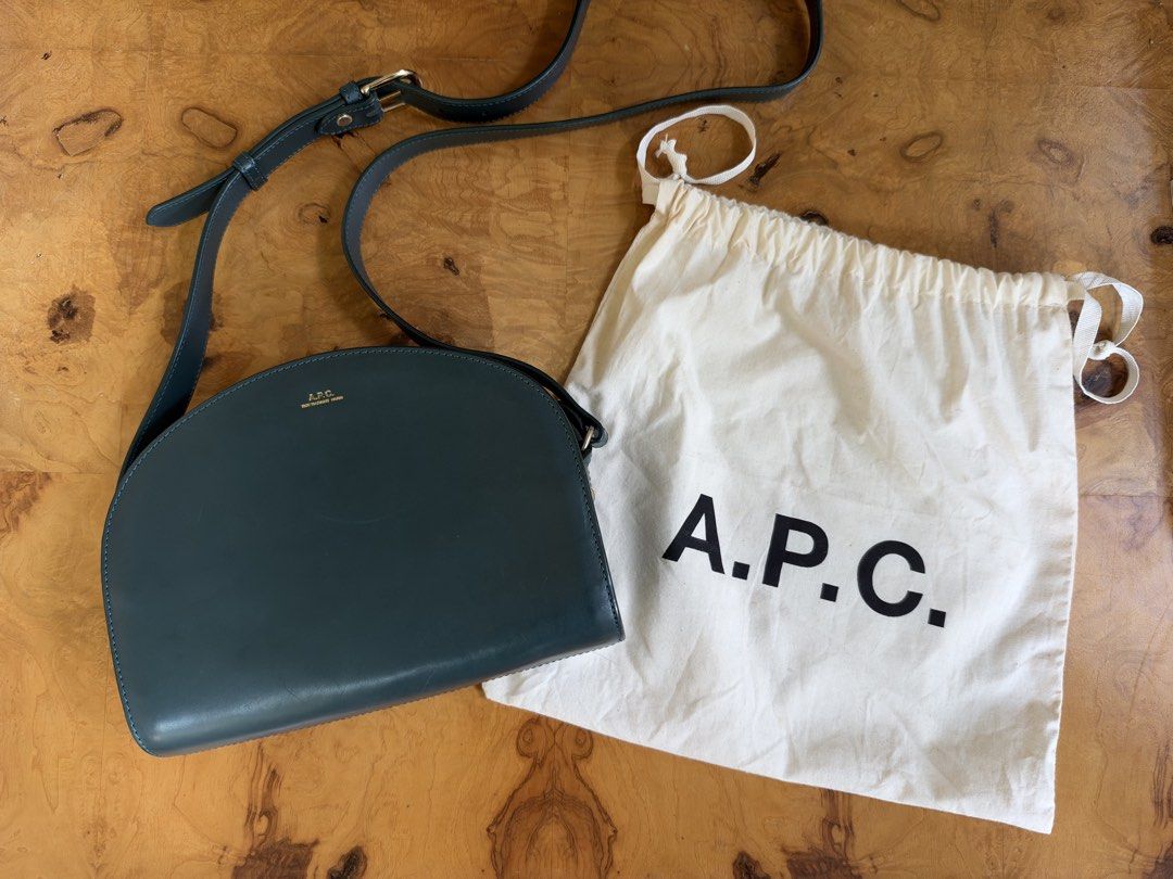 A.P.C. Half Moon Bag Dark Green (Category: Cross-body Bags) located in Muntinlupa City. Submitted by katoshops (Listing ID 1469200917, Image 2). Description: A.P.C. Demi-Lune Half-Moon Bag Current Market Price: 495.00 USD Selling Price: ₱5,500.00 Condition: Good (8/10) Reason for Selling: Don’t get to use this bag anymore. Additional Details: Color: Dark Green Worn: Used occasionally Flaws: - Light surface scratches and scuff marks: Visible on th