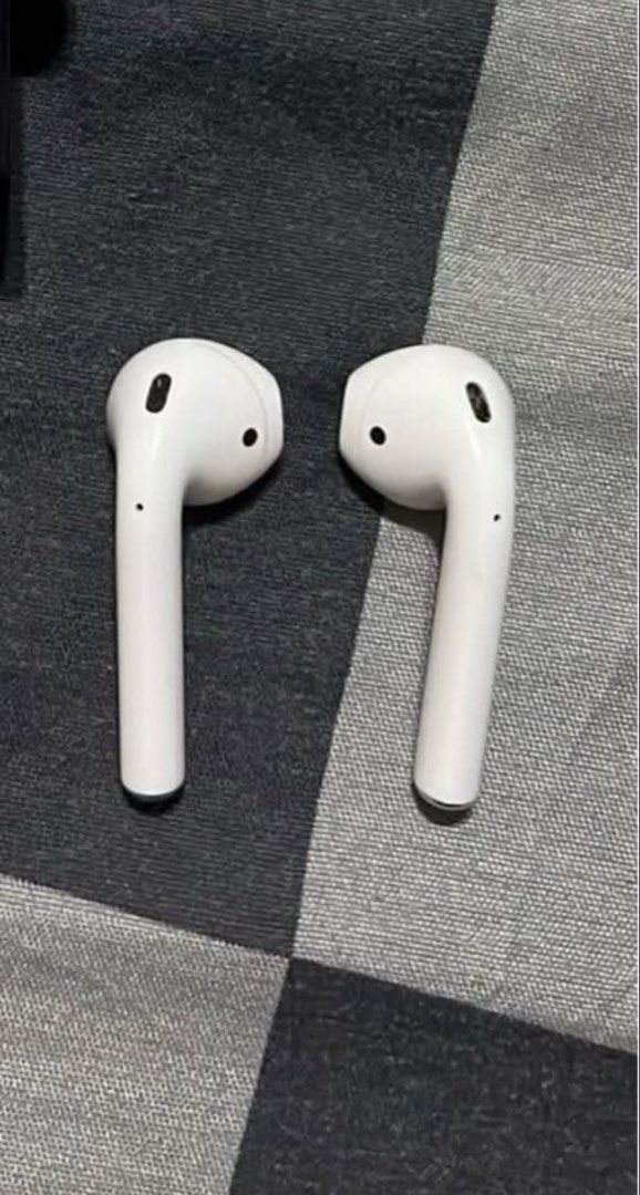 Apple AirPods 2nd Gen with Charging Case (Category: Earphones) located in Manila. Submitted by tyronecoronel (Listing ID 1469164650, Image 2). Description: - Airpods 2nd Gen - Fully working pair (both left and right earbuds included) - Sound quality tested, clear, and loud - Battery still holds a decent charge for daily use - Normal signs of daily handling on casing and buds - With free snoopy case - RFS: Decluttering/ nag upgrade na.