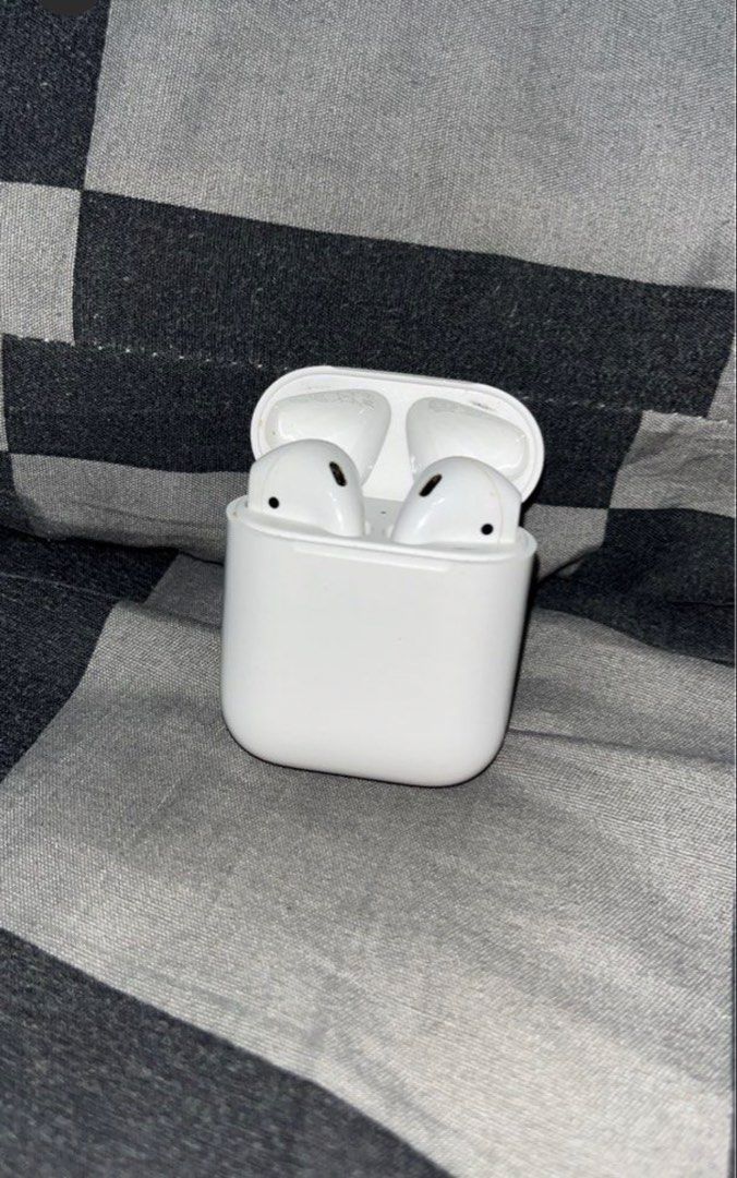 Apple AirPods 2nd Gen with Charging Case (Category: Earphones) located in Manila. Submitted by tyronecoronel (Listing ID 1469164650, Image 1). Description: - Airpods 2nd Gen - Fully working pair (both left and right earbuds included) - Sound quality tested, clear, and loud - Battery still holds a decent charge for daily use - Normal signs of daily handling on casing and buds - With free snoopy case - RFS: Decluttering/ nag upgrade na.