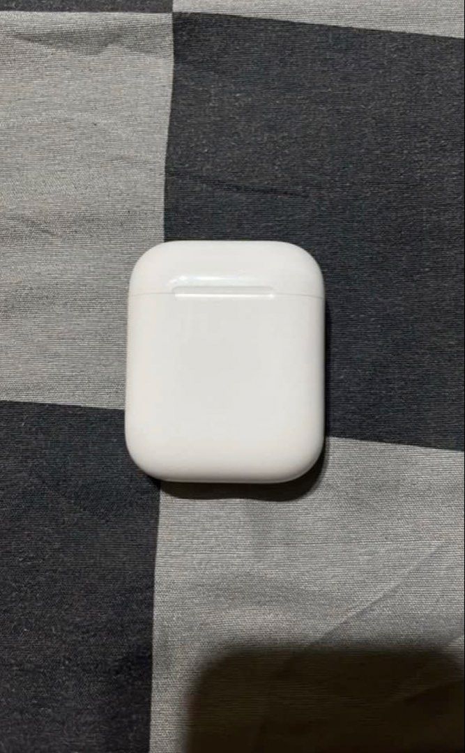 Apple AirPods 2nd Gen with Charging Case (Category: Earphones) located in Manila. Submitted by tyronecoronel (Listing ID 1469164650, Image 3). Description: - Airpods 2nd Gen - Fully working pair (both left and right earbuds included) - Sound quality tested, clear, and loud - Battery still holds a decent charge for daily use - Normal signs of daily handling on casing and buds - With free snoopy case - RFS: Decluttering/ nag upgrade na.