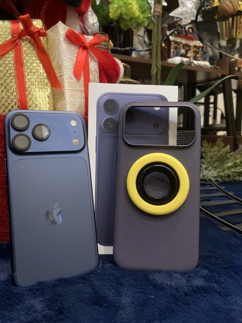 Apple iPhone 17 Pro Max Deep Blue 256GB (Category: iPhone 17 Series) located in Vintar. Submitted by jinonymous (Listing ID 1469300917, Image 2). Description: - Model: Apple iPhone 17 Pro Max (Model: MFYP4X/A) - Storage: 256GB - Color: Deep Blue - Condition: Brand new, unopened screen - Warranty: Apple limited warranty active until September 12, 2027 - Inclusions: Original box and matching case with yellow ring attachment - Serial Number: MQWG4XJ