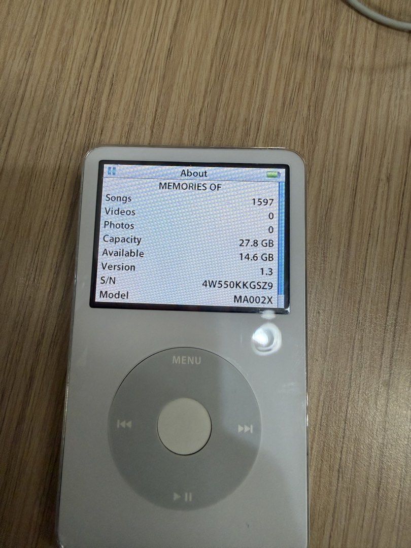 Apple iPod Classic 5th Generation 30GB White (Category: Portable Music Players) located in San Fernando. Submitted by houseof_jj (Listing ID 1469172944, Image 3). Description: Flaw: Loose center button - Model: Apple iPod Classic 5th Generation - Storage: 30GB - Color: Classic White front with shiny chrome back - Condition: Fully working, screen and click wheel are very responsive - Flaws: Standard surface scratches on the rear casing from normal