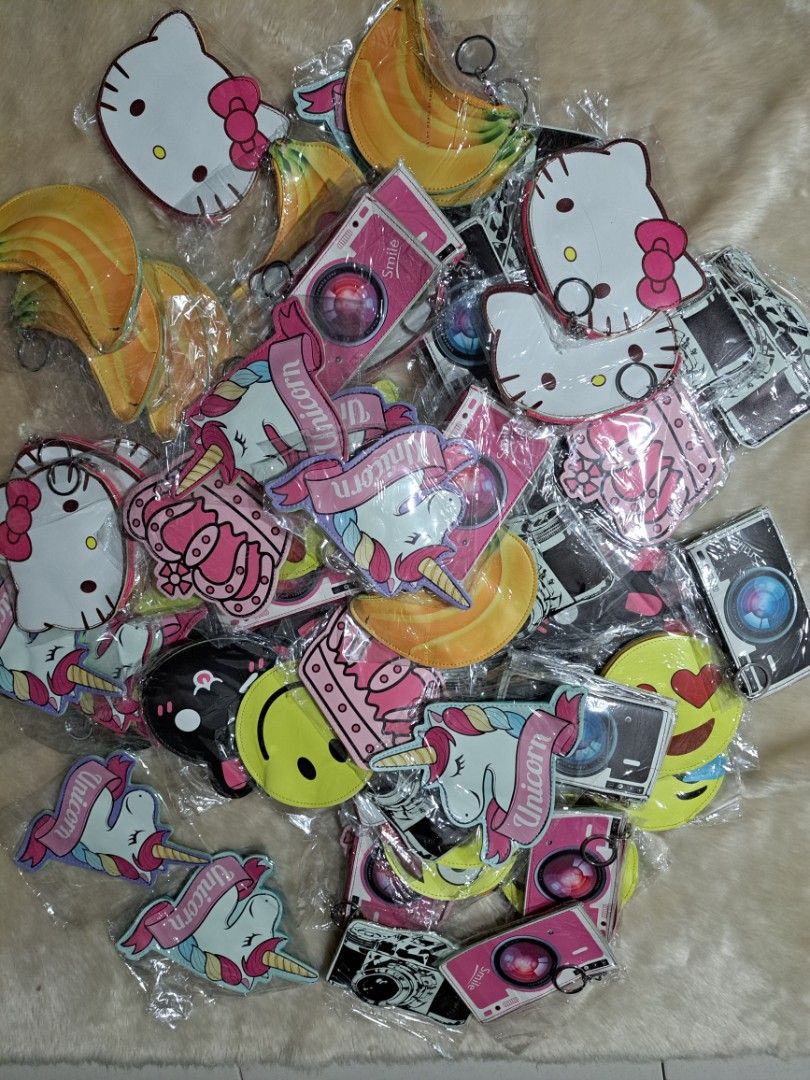 Assorted Cute Character Coin Pouches Keychains (Category: Purses & Pouches) located in Quezon City. Submitted by sbvdmanaog (Listing ID 1469204039, Image 3). Description: SALE 3pcs for 100 - Cute and trendy designs: Unicorn, Kitty, banana, emojis, crown, and camera - Multi-purpose: Ideal for keeping keys, loose change, or small trinkets organized - Convenient: Every pouch comes with a handy attachment ring - Clean and ready: Each piece is individ
