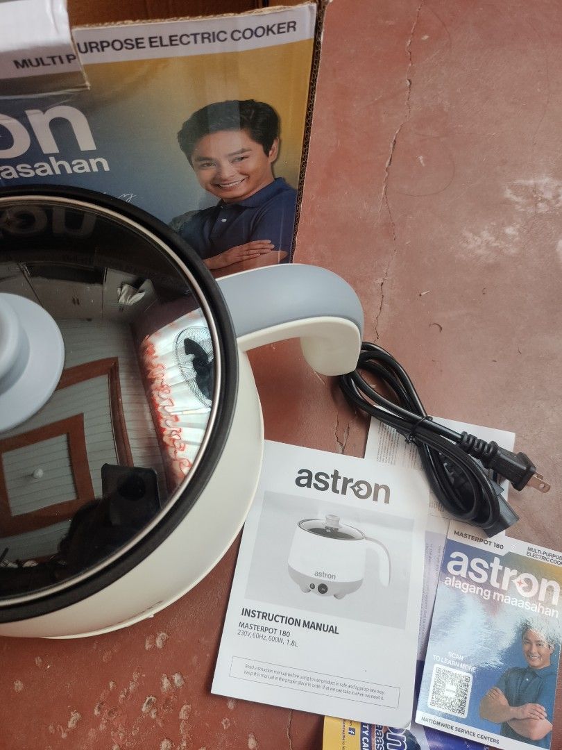 Astron Masterpot 180 Multi-Purpose Electric Cooker (Category: Cookers) located in Cordon. Submitted by joymantis (Listing ID 1469175844, Image 2). Description: - Brand: Astron Masterpot 180 Multi-Purpose Electric Cooker - Color: Cream and grey body with black non-stick inner pot - Capacity & Power: 1.8 Liters, 600 Watts, 230V - Features: Ideal for quick meals, boiling, frying, and perfect for dorms or small spaces - Inclusions: Clear glass lid, p