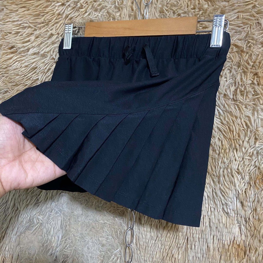Athlete Black Tennis Skort (Category: Activewear) located in Butuan. Submitted by jc13thrifts (Listing ID 1469338616, Image 3). Description: - Brand: Athlete - Color: Black - Size: Kids Size 10 / 140cm - Design: Built-in shorts underneath with a cute pleated skirt overlay in front - Waistband: Elastic with adjustable drawstring closure - Extra feature: Small reflective logo near the hem for safety - Ideal for: Tennis, badminton, running, and acti